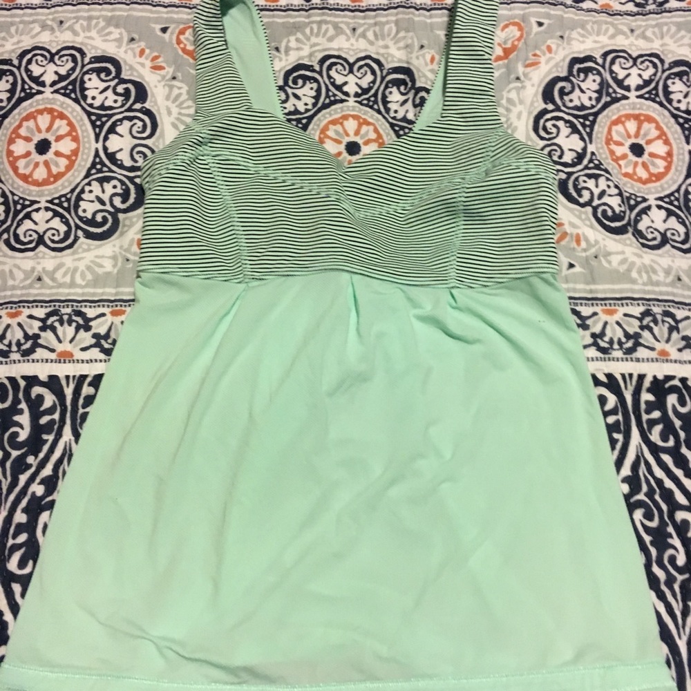 Turquoise lululemon top. Stripes at the top.